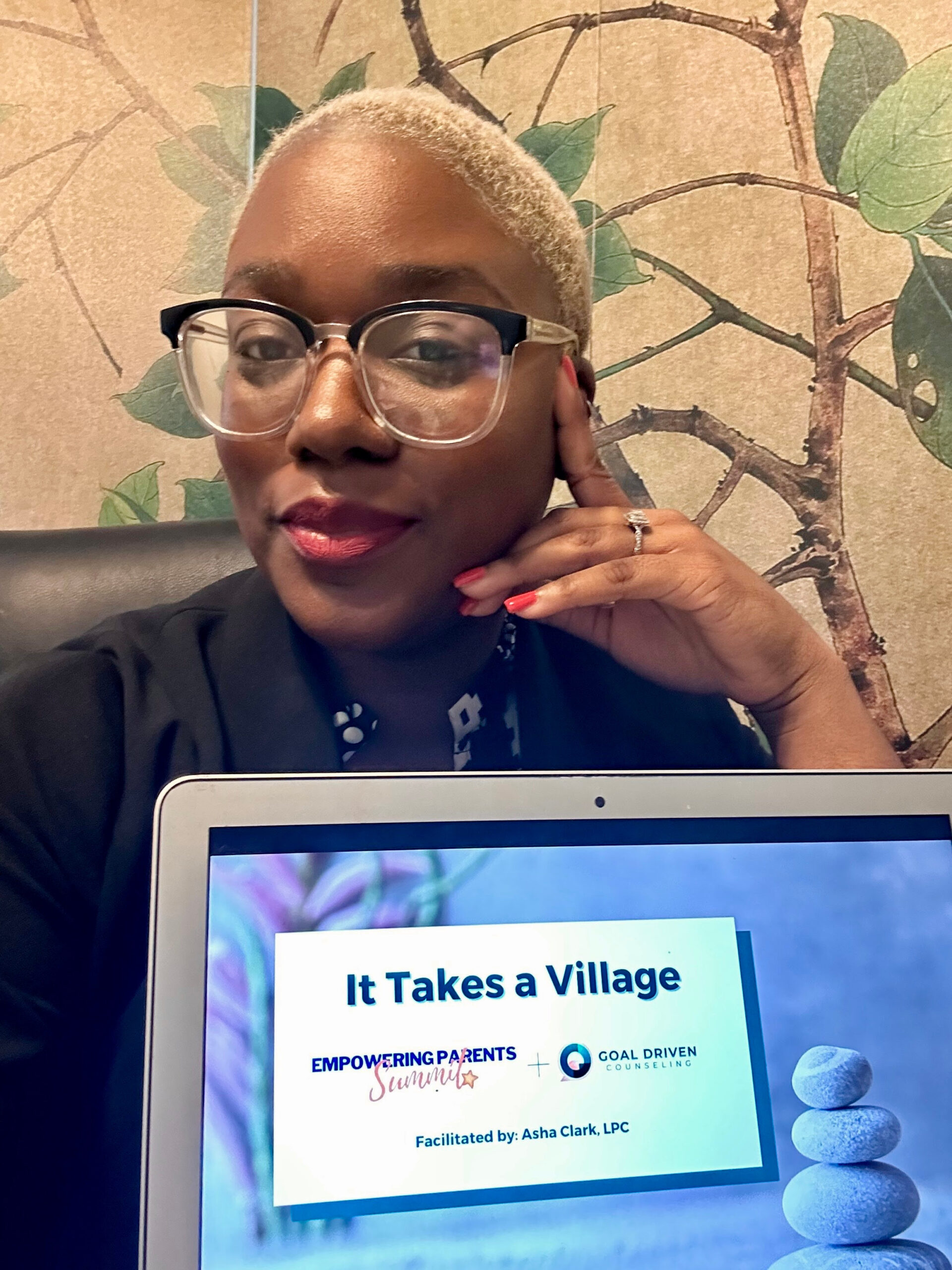 Asha Clark-Carter with her It Takes a Village community presentation