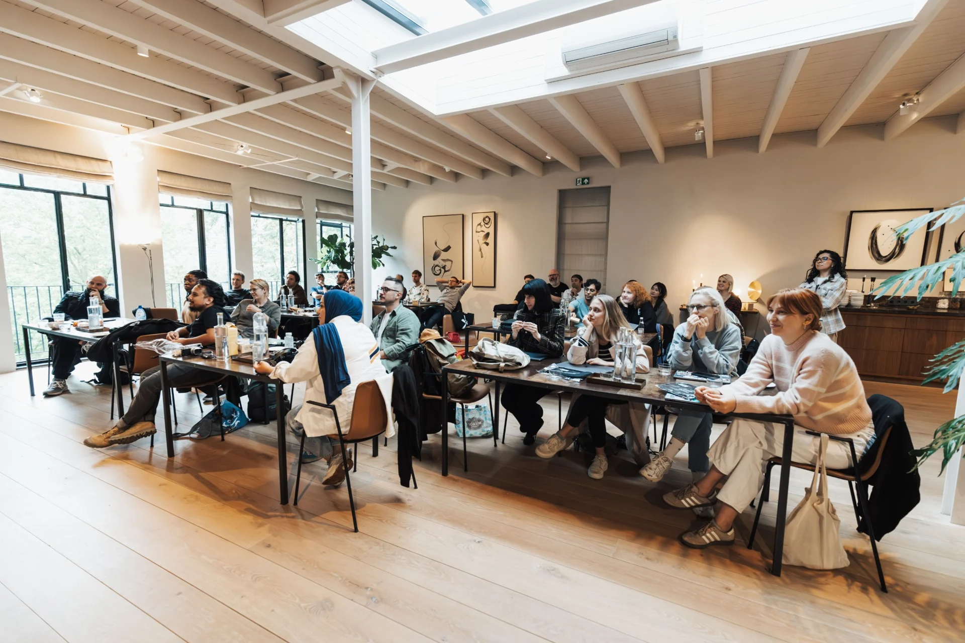 Participants listening during a workplace learning session