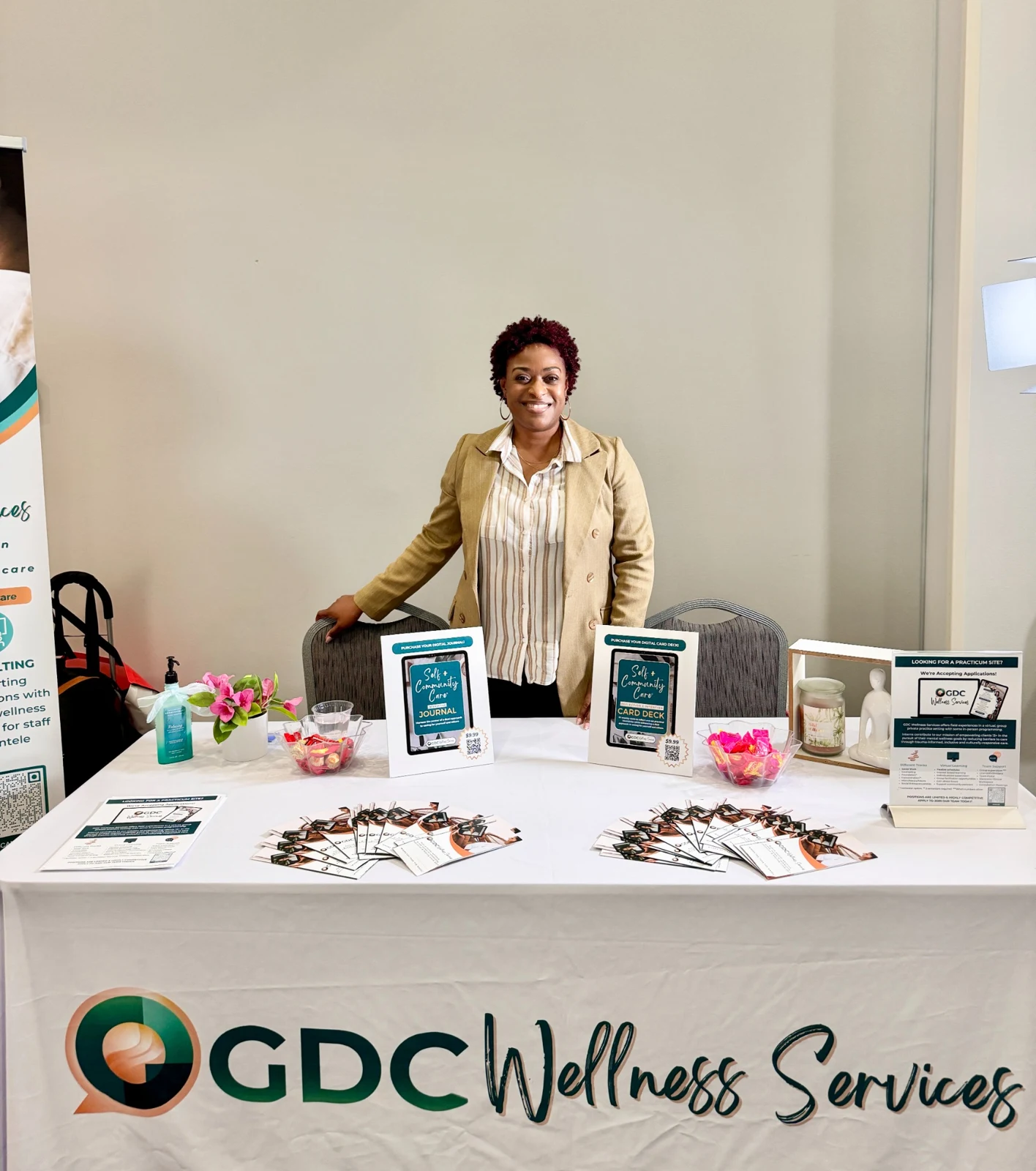 Melissa at a GDC Wellness Services community event display